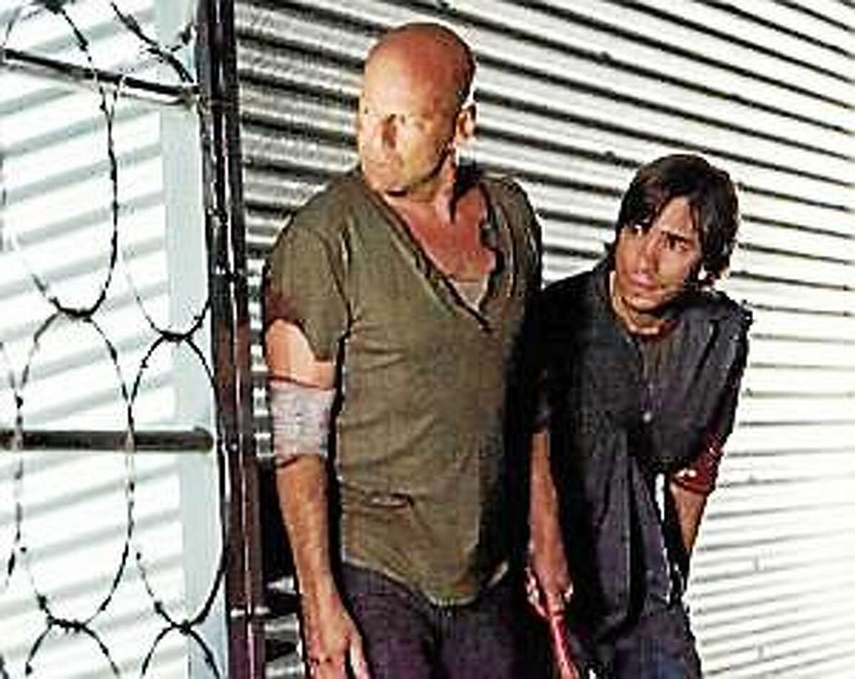 John McClane (Bruce Willis), left, and Matt Farrell (Justin Long) in “Live Free or Die Hard.”