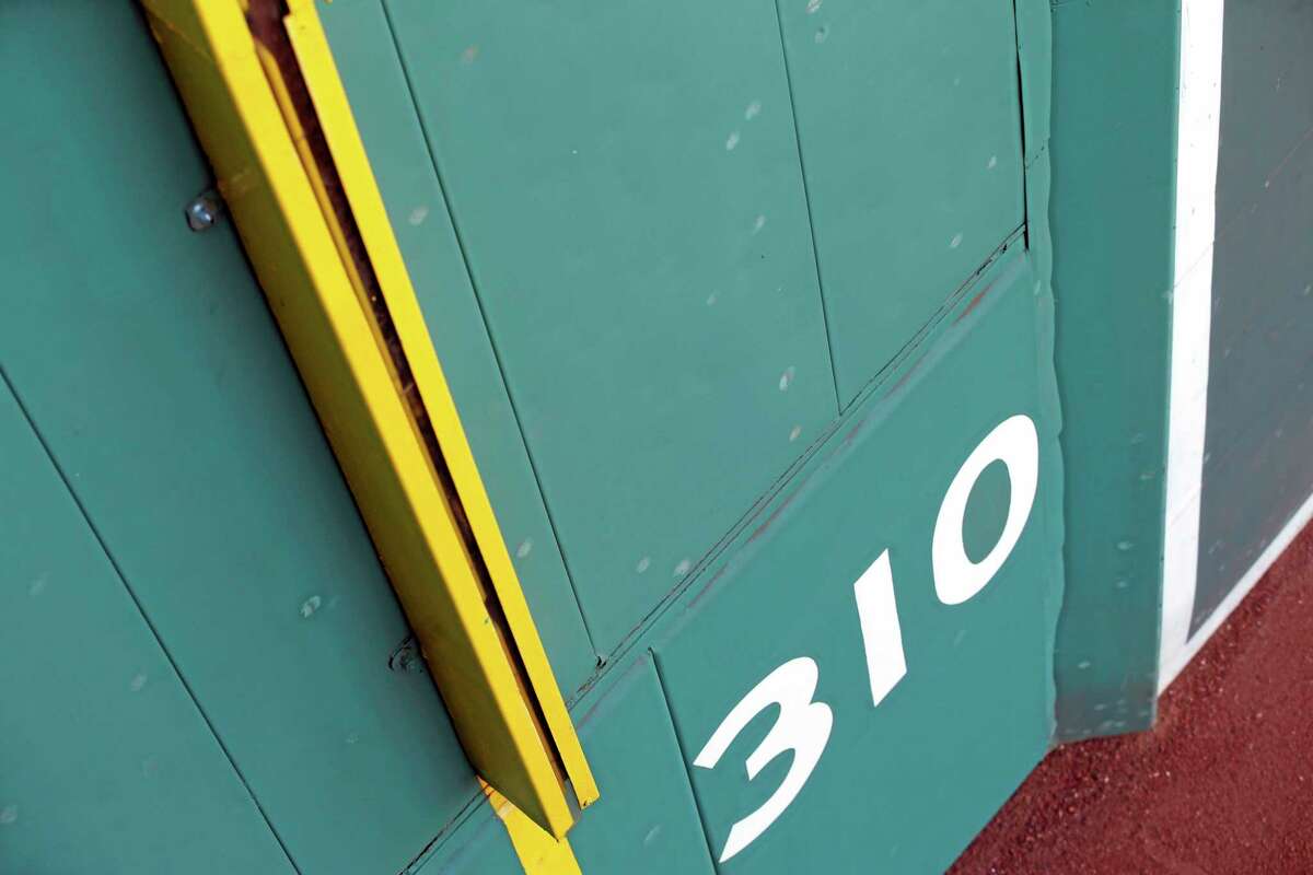 Baseball scuff marks are seen on the Green Monster at Fenway Park in Boston. Up close, the famous left-field wall is pocked with thousands of dents and white scuff marks left from decades of doubles that banged off of its facade. Some of the spots are so well-defined that you can even make out the red stitches from the baseball, the Rawlings logo or the Major League Baseball insignia left behind on the green background.