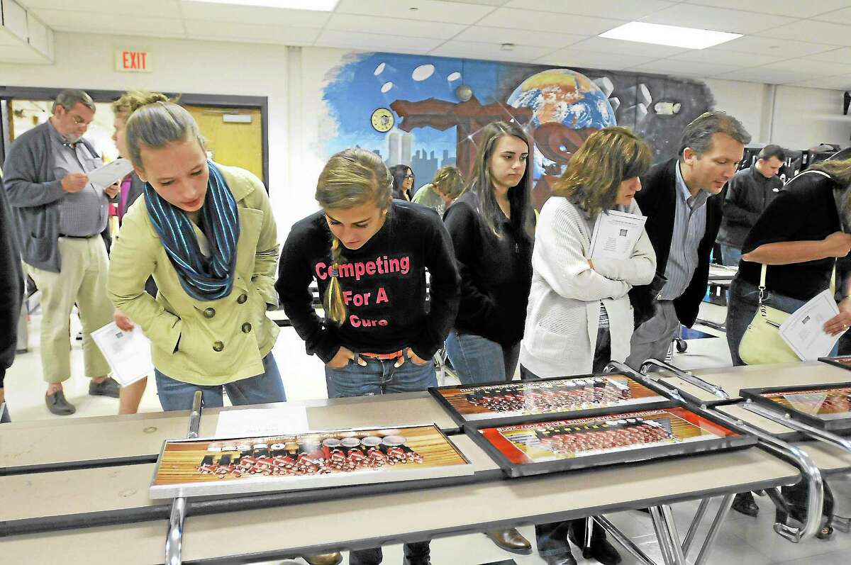 Students look over some of the memorabilia on display before the band awards ceremony on Tuesday.