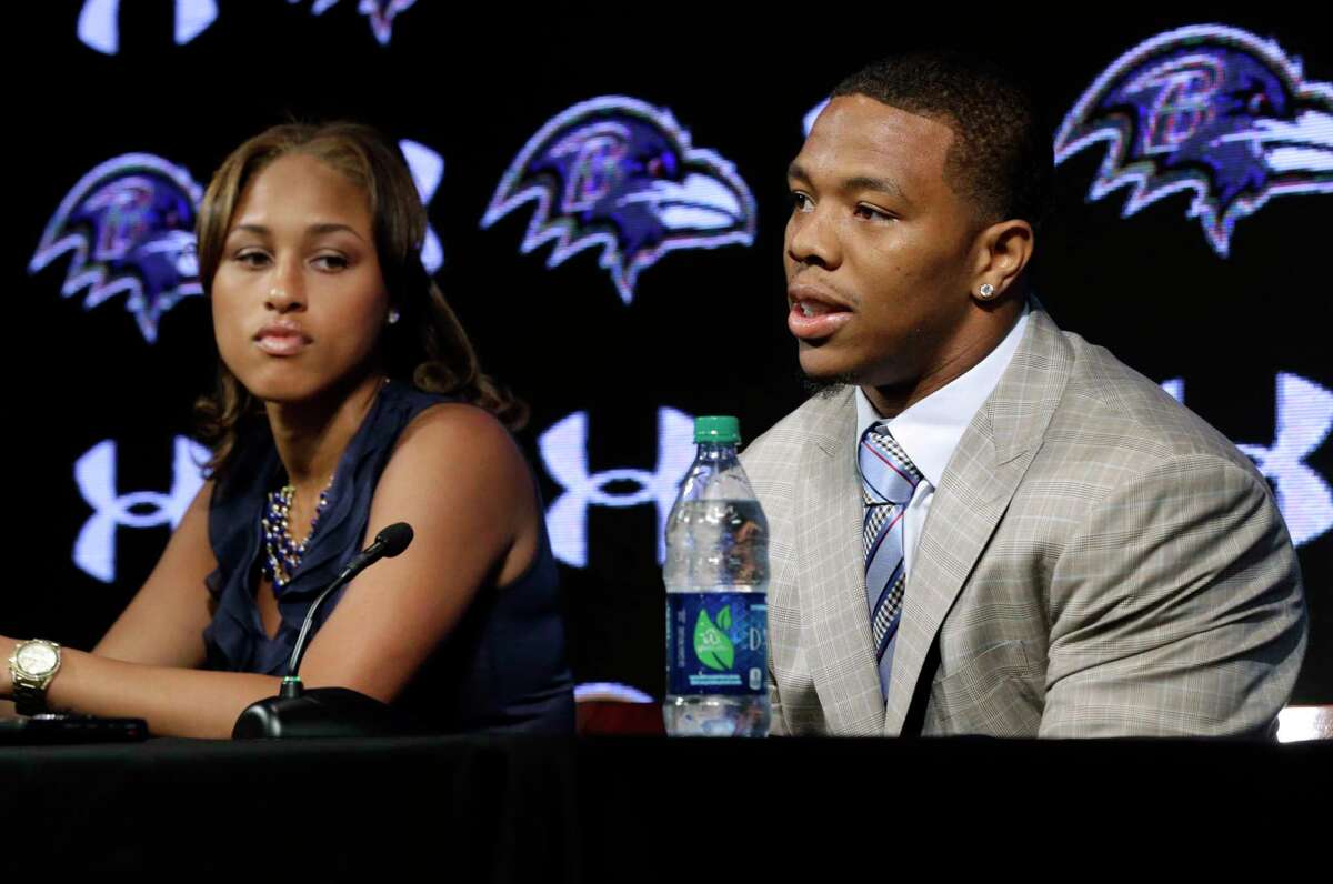 In this May 23, 2014 file photo, Baltimore Ravens running back Ray Rice, right, speaks alongside his wife, Janay, during a news conference at the team’s practice facility in Owings Mills, Md. A new video that appears to show Ray Rice striking then-fiance Janay Palmer in an elevator last February has been released on a website.