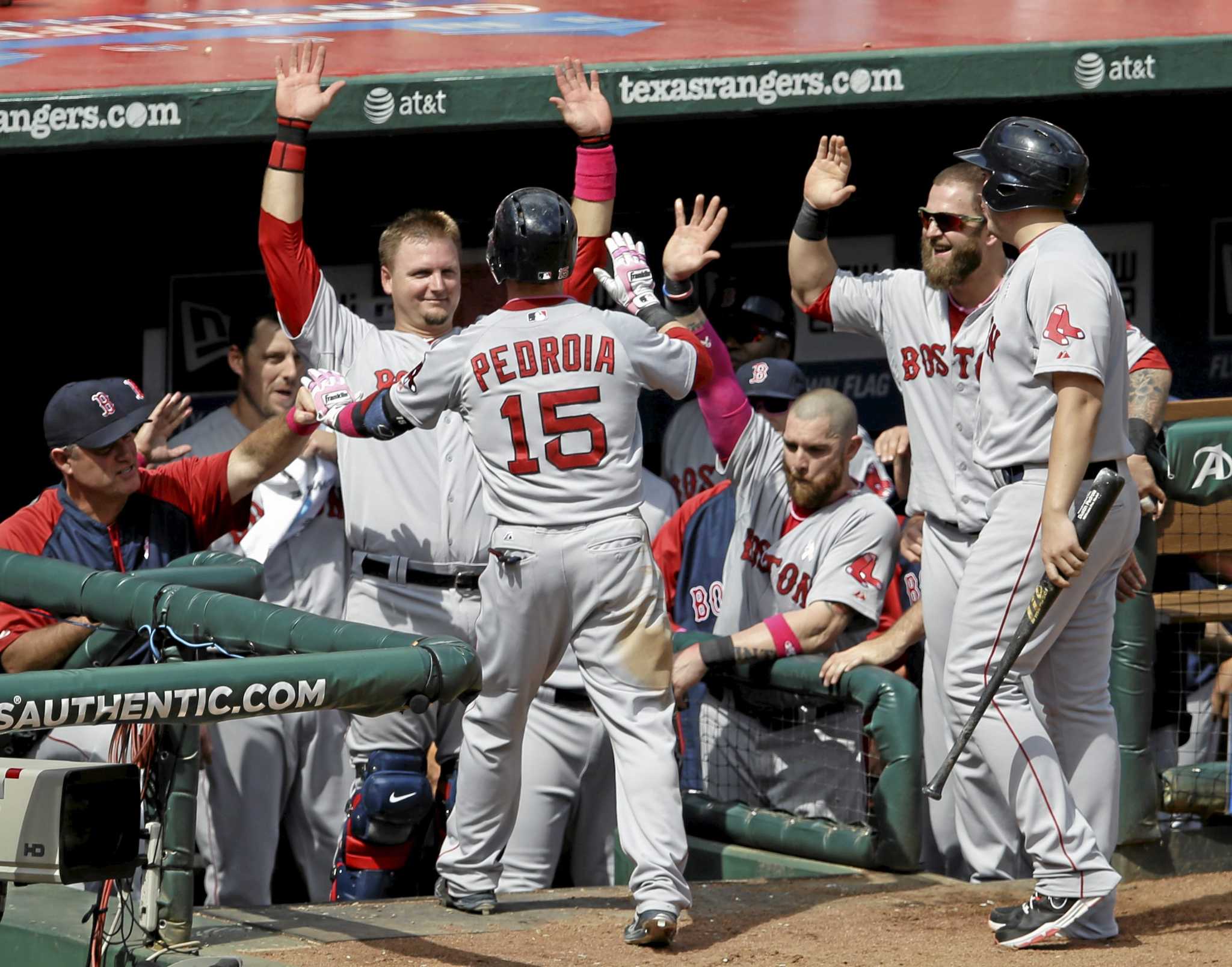 Red Sox second baseman Dustin Pedroia, No. 15 inside the dugout at