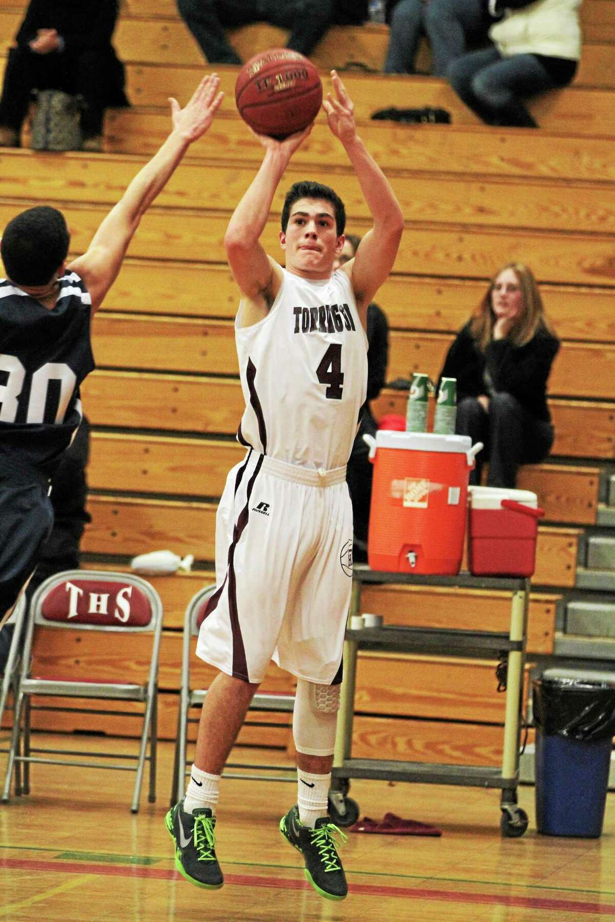 Torrington’s John McCarthy takes a shot in the Red Raiders 55-52 win over Ansonia.