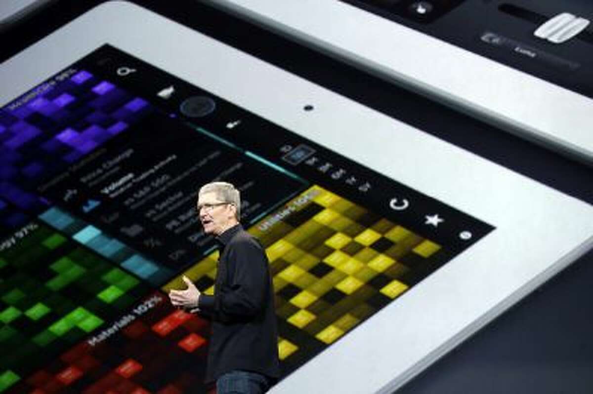 Apple CEO Tim Cook speaks on stage before a new product introduction on Tuesday, Oct. 22, 2013, in San Francisco.