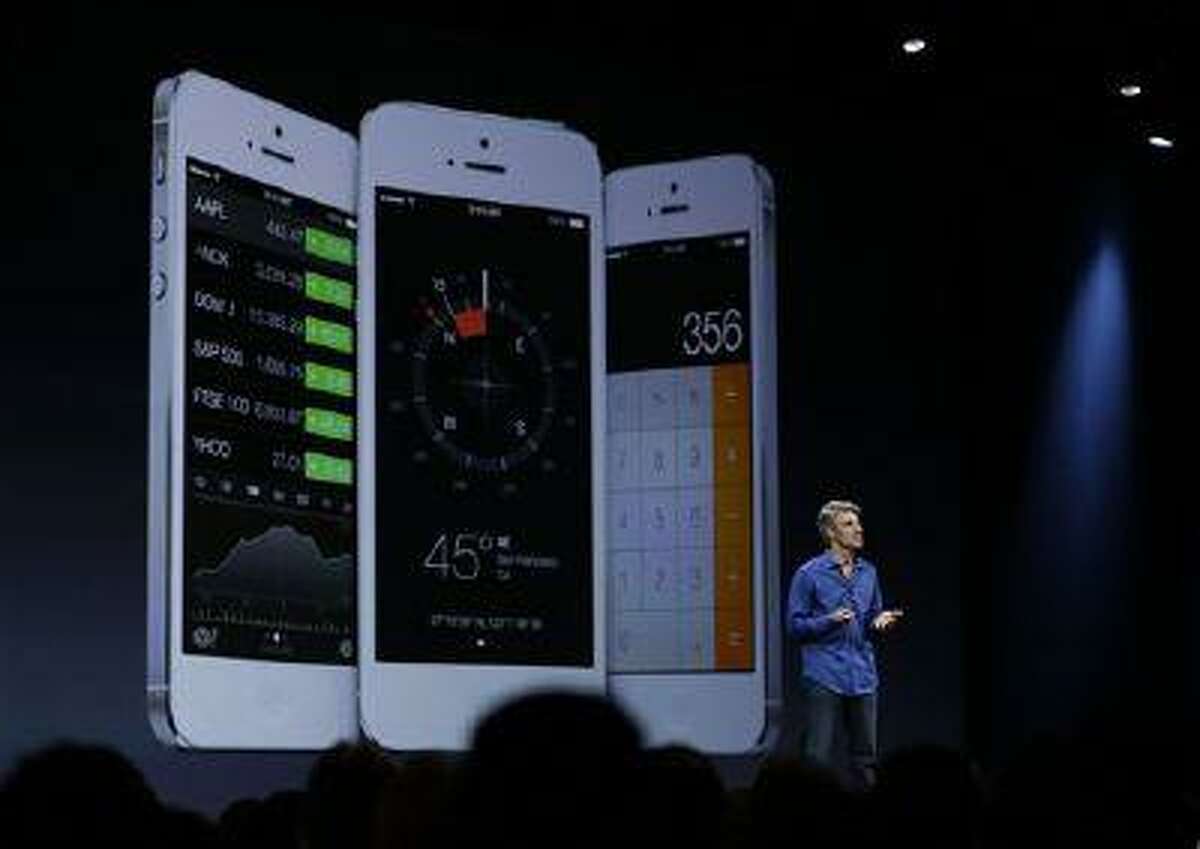 Craig Federighi, senior vice president of Software Engineering at Apple talks about the features of the new iOS 7 during the keynote address of the Apple Worldwide Developers Conference Monday, June 10, 2013 in San Francisco. (AP Photo/Eric Risberg)
