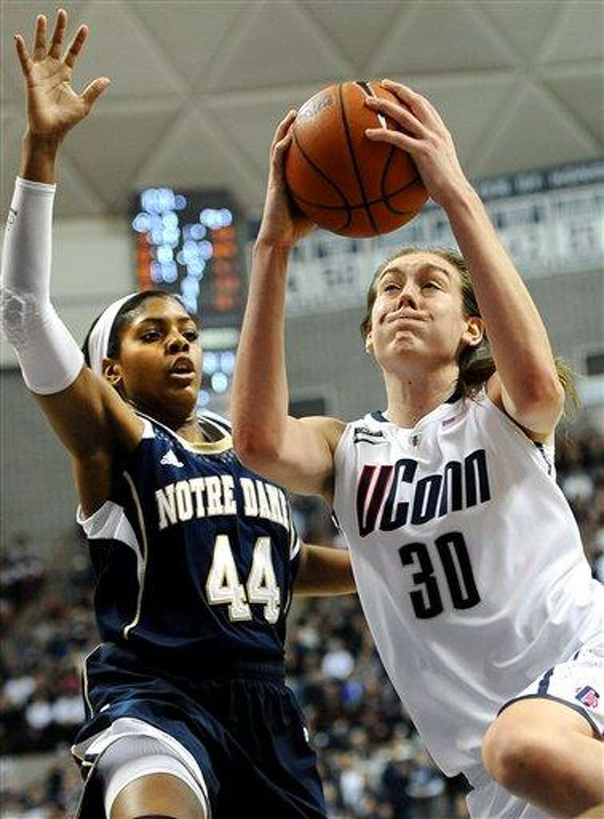Connecticut's Breanna Stewart (30) drives to the basket while guarded by Notre Dame's Ariel Braker during the second half of an NCAA college basketball game in Storrs, Conn., Saturday, Jan. 5, 2013. Notre Dame won 73-72. (AP Photo/Jessica Hill)
