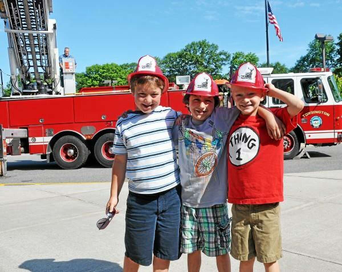 Tommy Pataky, Tristan Ladona, and Owen Nilsen in front of the fire truck they rode to school Monday morning. (Photo courtesy of Rebekah Ladonna - bekahphotography)