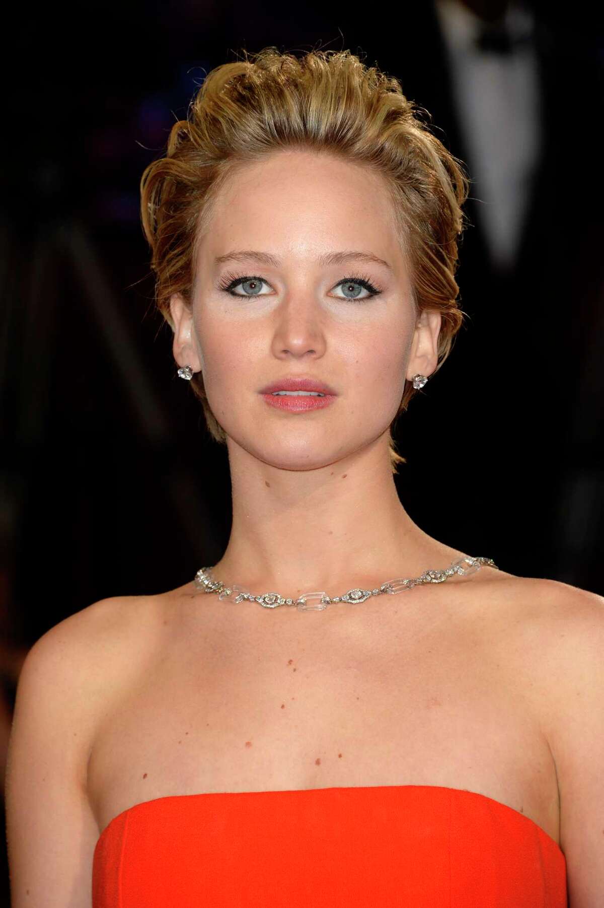 FILE - In this Sunday, March 2, 2014, file photo, Jennifer Lawrence arrives at the Oscars at the Dolby Theatre in Los Angeles. A publicist for Lawrence says the actress has contacted authorities after nude photos of her were apparently stolen and posted online. Intimate images of the Oscar-winning actress began appearing online on Sunday, Aug. 31, 2014, and nude images purported to be of other female celebrities were also being circulated online. The source of the leak was not immediately known. (Photo by Dan Steinberg/Invision/AP, File)