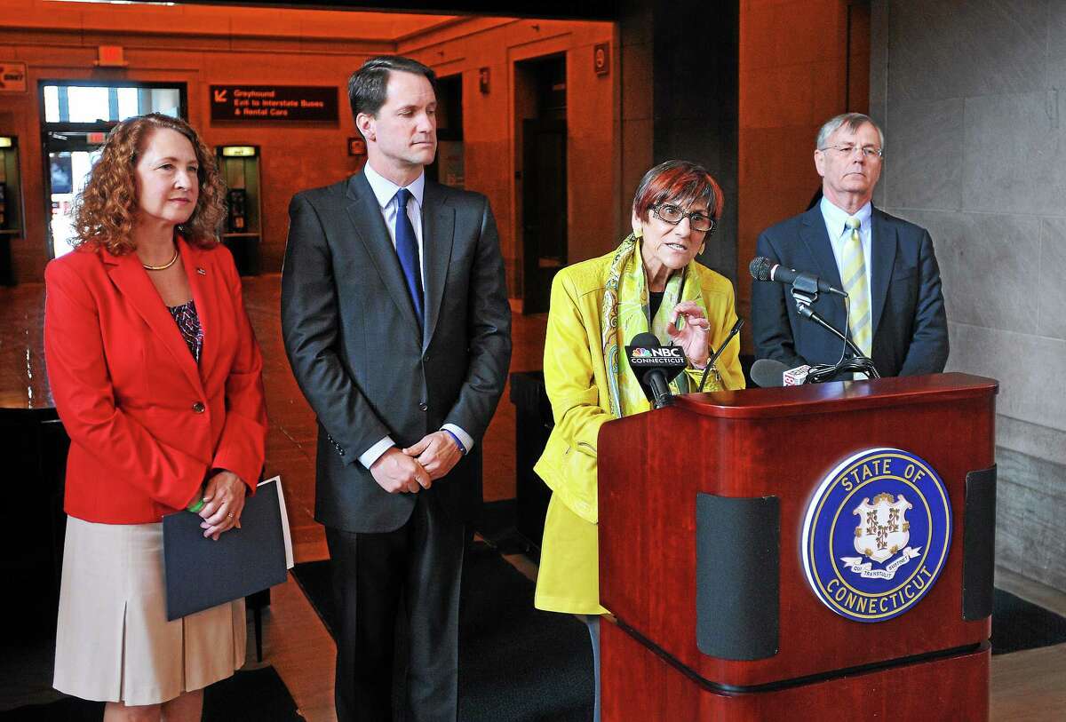 U.S. Rep. Rosa L. DeLauro, D-3, unveils a comprehensive rail safety plan at Union Station during a press conference Tuesday morning in New Haven. Behind DeLauro are U.S. Reps. Elizabeth Esty, D-5, and Jim Himes, D-4, and DOT Commissioner James Redeker.