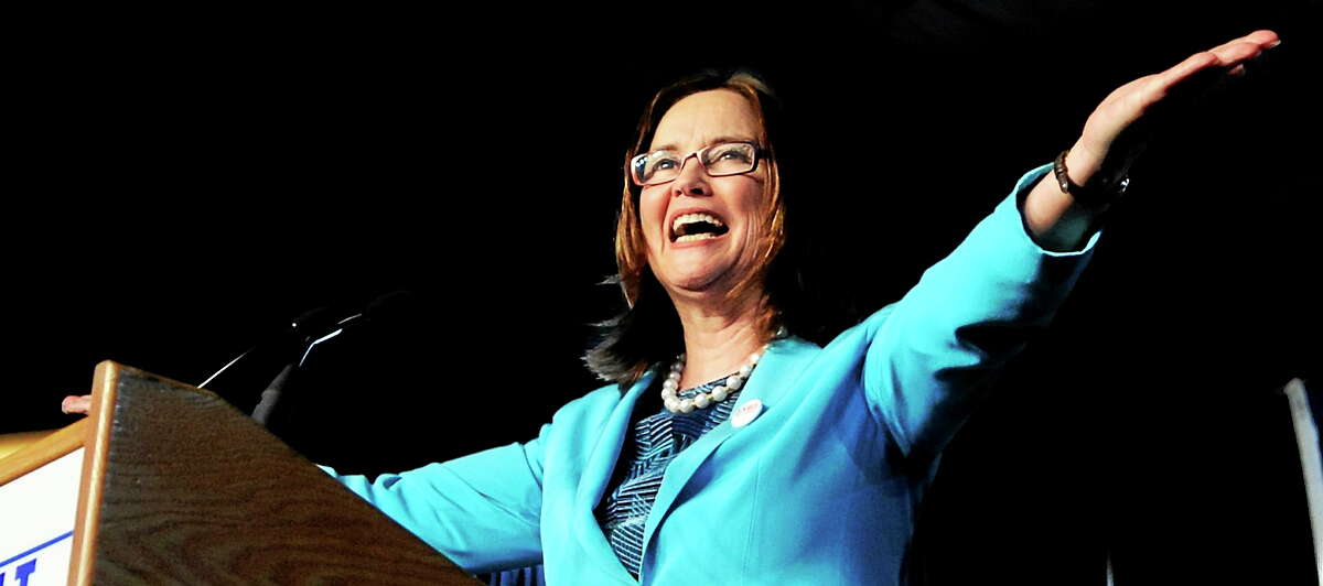 Denise Merrill cheers at the podium after she was nominated as Secretary of the State at the Democratic state convention on May 22, 2010.