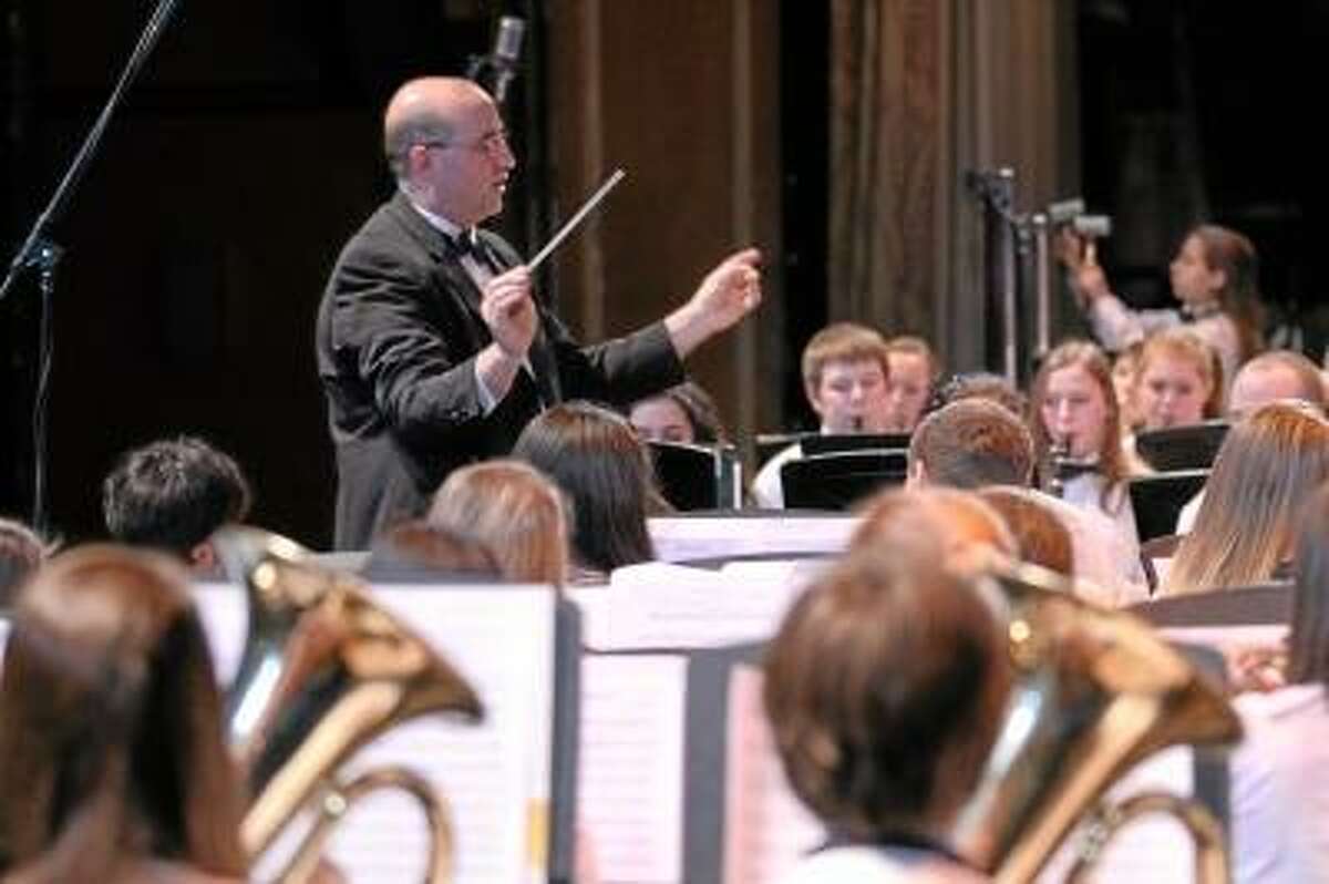 Photos by Marianne Killackey Wayne Splettstoeszer conducts the Torrington High School Concert Band as they perform in the Tri Town Band Festival, a collaborative effort of Torrington, Northwestern Regional 7, and Canton High Schools. The concert was held at the Warner Theatre on Tuesday night.