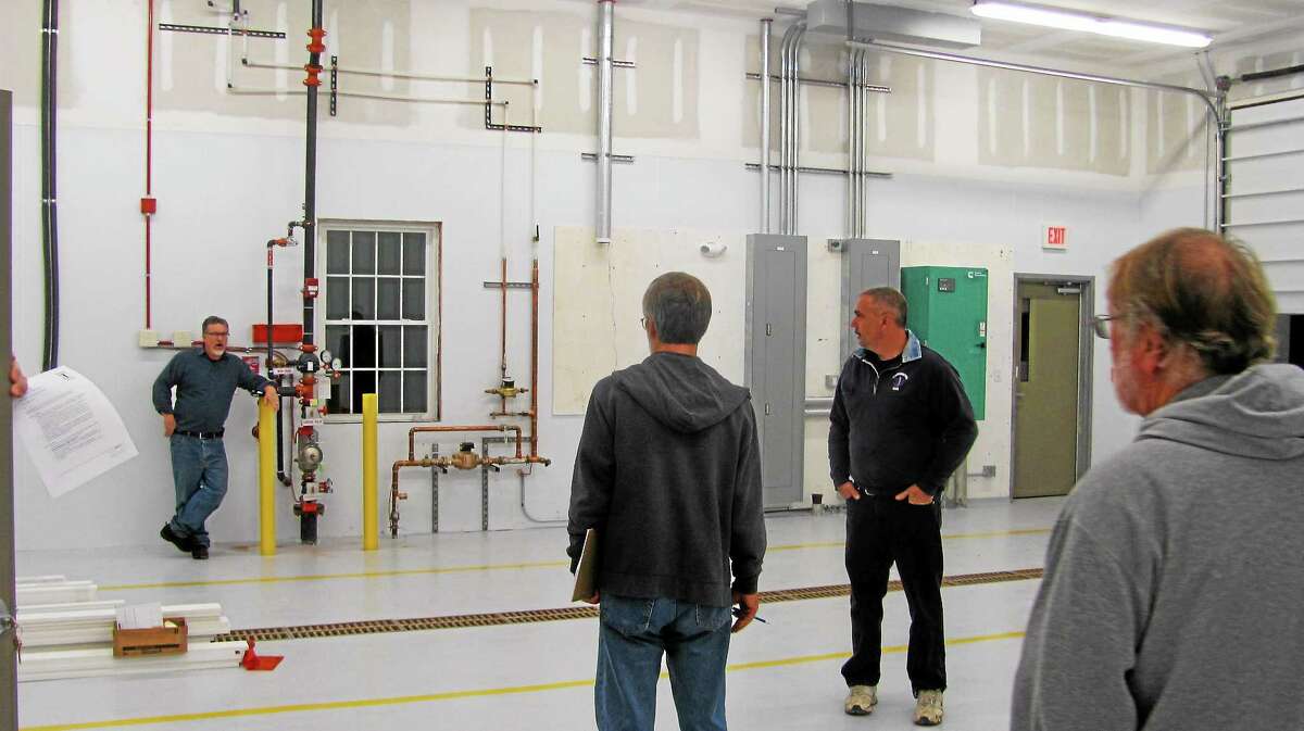 Members of the Harwinton Ambulance Building Committee tour the inside of the town’s new emergency services facility, located at 166 Burlington Road.