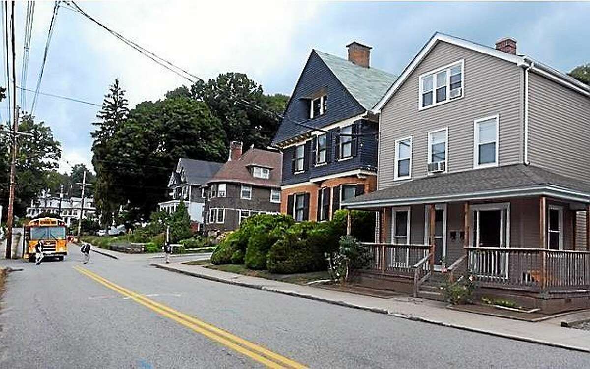 Screenshot: Two sex offenders are living in the home at 152 Broad St. in Norwich, the house on the right, close to where children were getting off the school bus Tuesday. (Aaron Flaum/ NorwichBulletin.com)