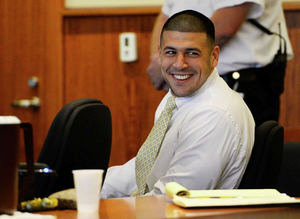Former New England Patriots NFL football player Aaron Hernandez attends an evidentiary hearing at Bristol County Superior Court, Thursday, Oct. 2, 2014, in Fall River, Mass. Hernandez, 24, has pleaded not guilty to first-degree murder in the 2013 shooting death of Odin Lloyd, a Boston semi-professional football player who was dating the sister of Hernandez's fiancee. (AP Photo/CJ Gunther, Pool)