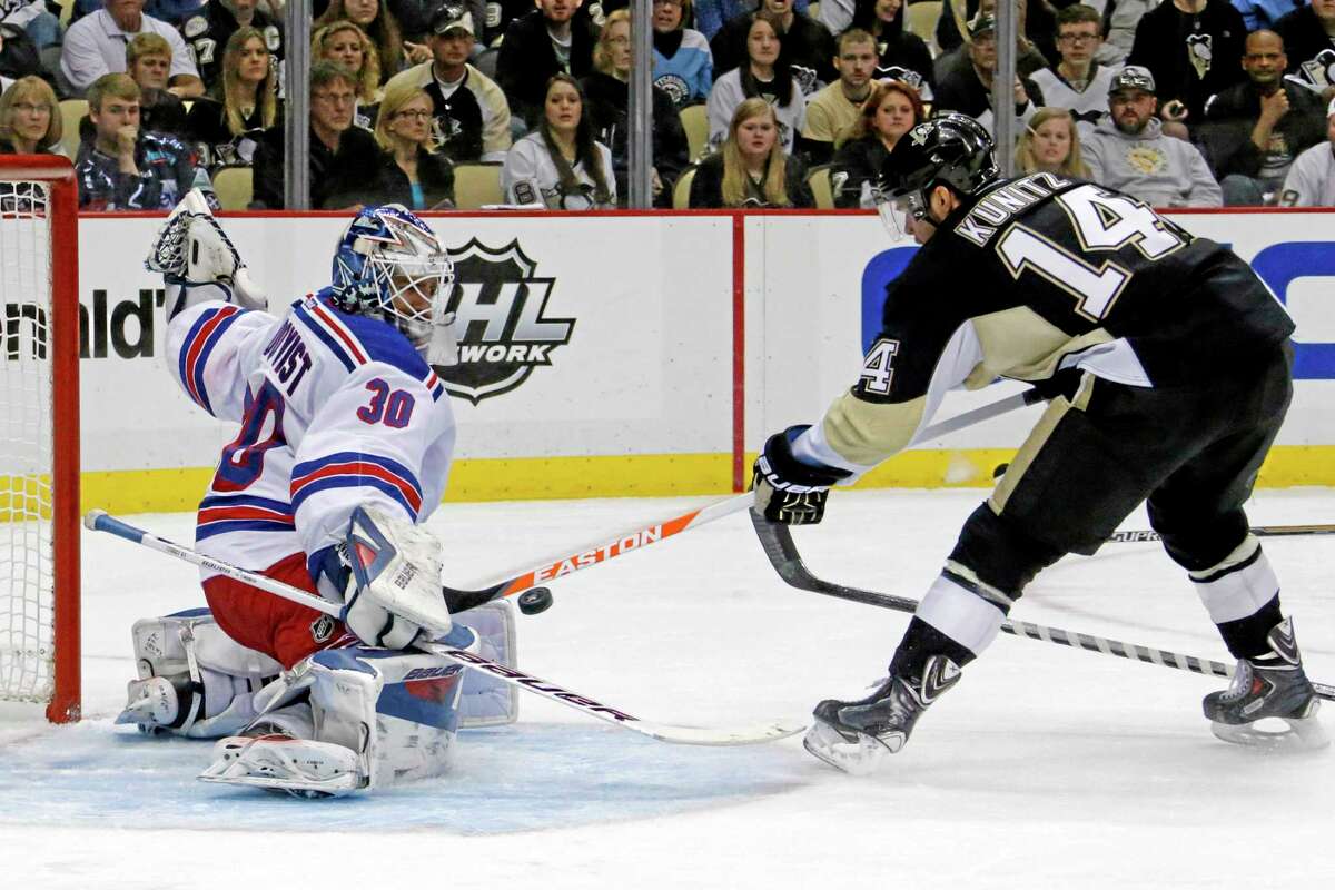 New York Rangers goalie Henrik Lundqvist can’t stop a shot from the point by the Penguins’ Kris Letang in the second period Sunday night.
