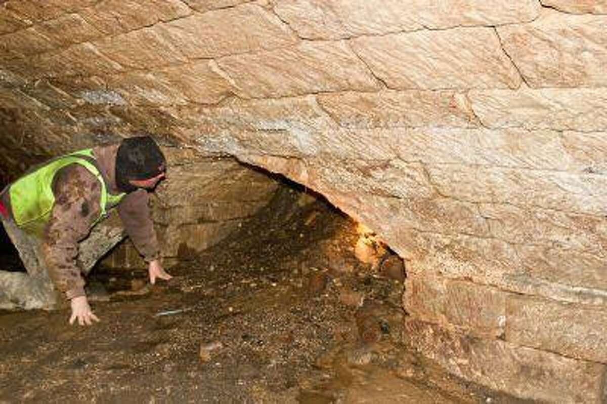 An Amherst, Ohio, city worker checks out a passage in the underground chamber discovered by workers last week.
