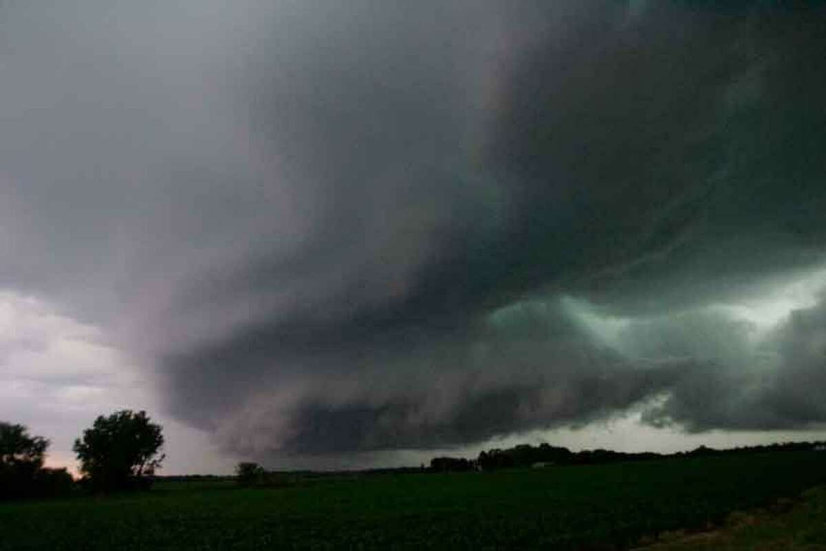 A wall cloud, containing a reported funnel cloud, passes over the Wanatah, Ind. area as a line of severe storm moves through the area Wednesday June 12, 2013. (AP Photo/The LaPorte Herald-Argus, Bob Wellinski)
