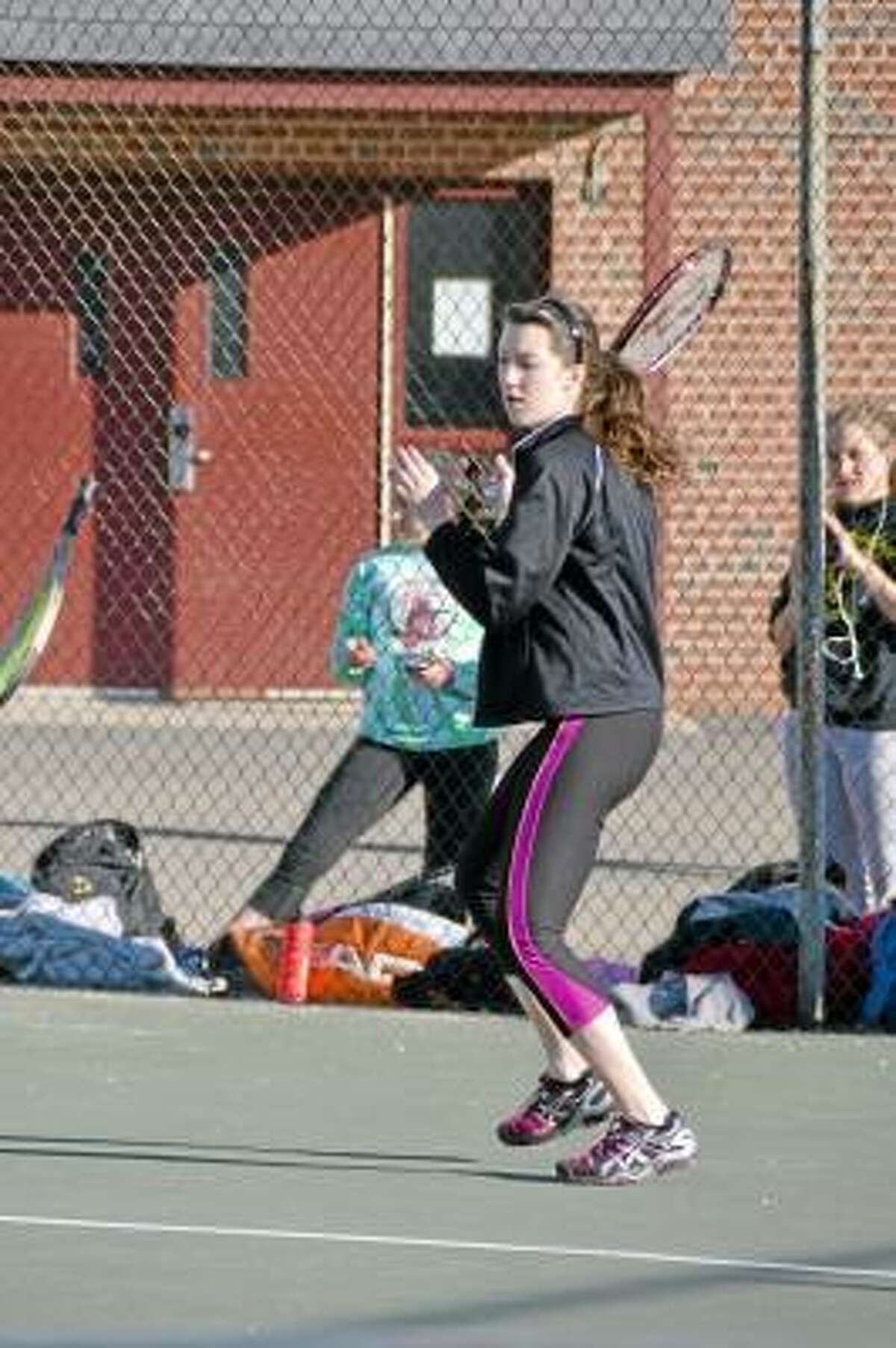 Pete Paguaga/Register Citizen Thomaston's Allison Snow, returning a serve during practice. She is slated to be the Golden Bears, number three in singles this season.