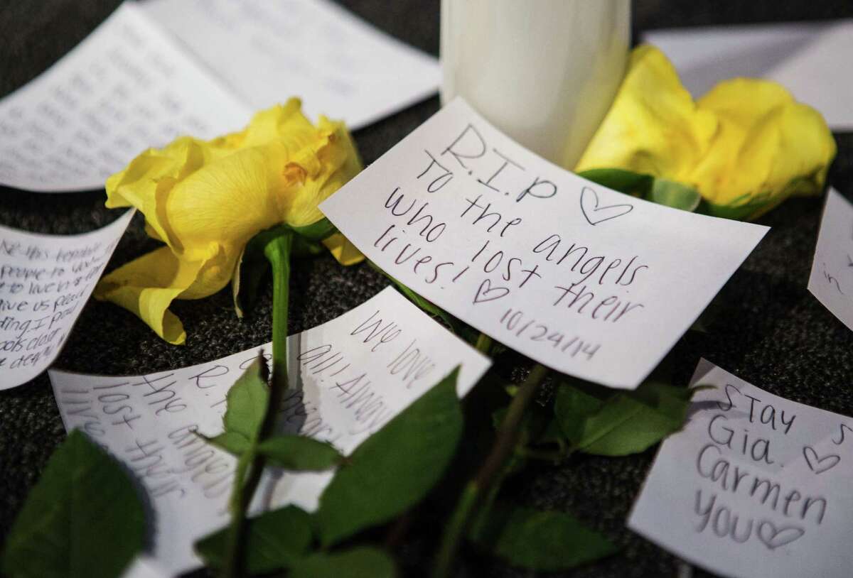 Messages of support on the stage near candles and flowers in between morning services at The Grove Church in Marysville, Wash., two days after the Marysville-Pilchuck High School shooting, on Sunday.
