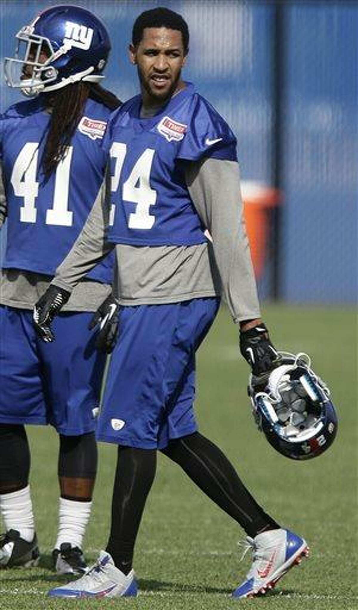 New York Giants' Terrell Thomas (24) walks on the field during mini camp Tuesday, June 11, 2013, in East Rutherford, N.J. (AP Photo/Frank Franklin II)