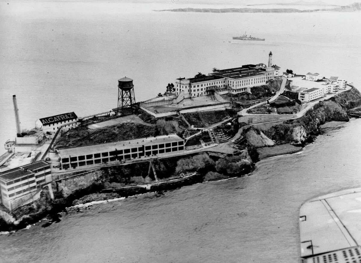 This is an undated aerial view of the federal prison island Alcatraz, also known as "The Rock," in the San Francisco Bay, California. On the left are the facilities of the Model Industries buildings, up on the hill is the cellhouse with the high-walled recreation yard in front. (AP Photo)
