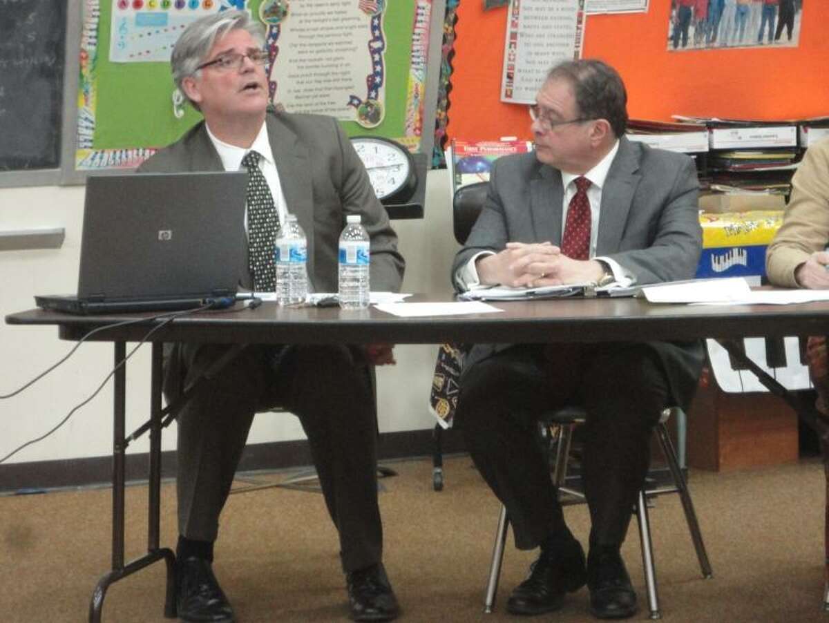 Photo by Jason Siedzik -- Winchester Superintendent of Schools Thomas Danehy, left, and Gilbert School Superintendent Anthony Serio run down their proposed budgets in a special joint meeting between the Board of Education and Board of Selectmen.