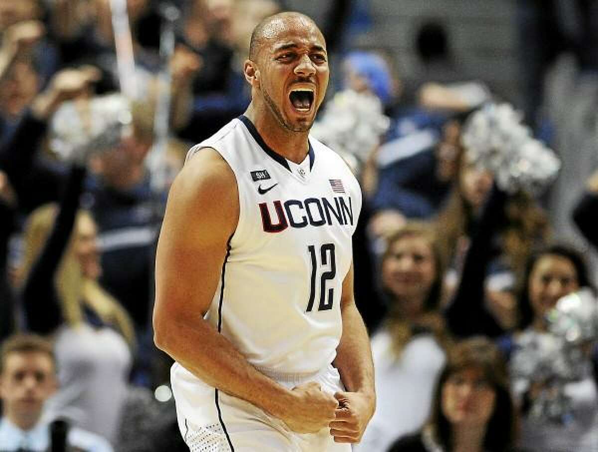 Connecticut's R.J. Evans reacts after being fouled while making a basket during the first half of an NCAA college basketball game against Syracuse in Hartford, Conn., Wednesday, Feb. 13, 2013.(AP Photo/Jessica Hill)