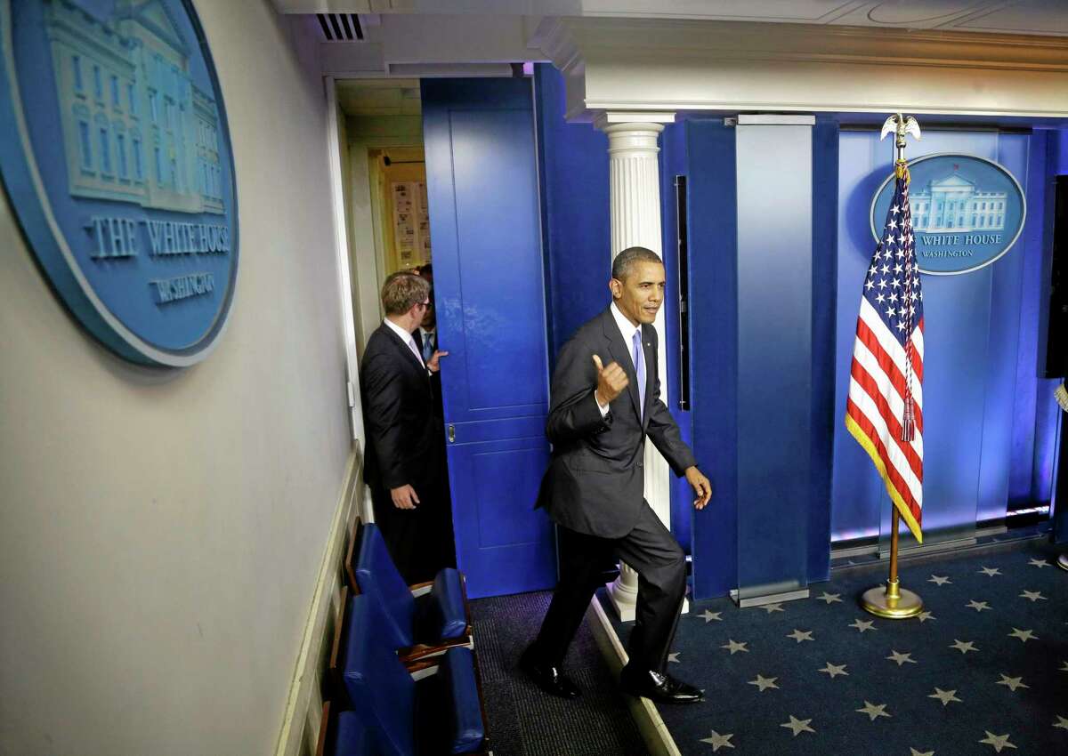 President Barack Obama walks out to make a statement to reporters in the Brady Press Briefing Room at the White House in Washington, Wednesday, Oct. 16, 2013. The Senate voted to avoid a financial default and reopen the government after a 16-day partial shutdown and the measure now heads to the House, which is expected to back the bill before day's end. (AP Photo/Pablo Martinez Monsivais)