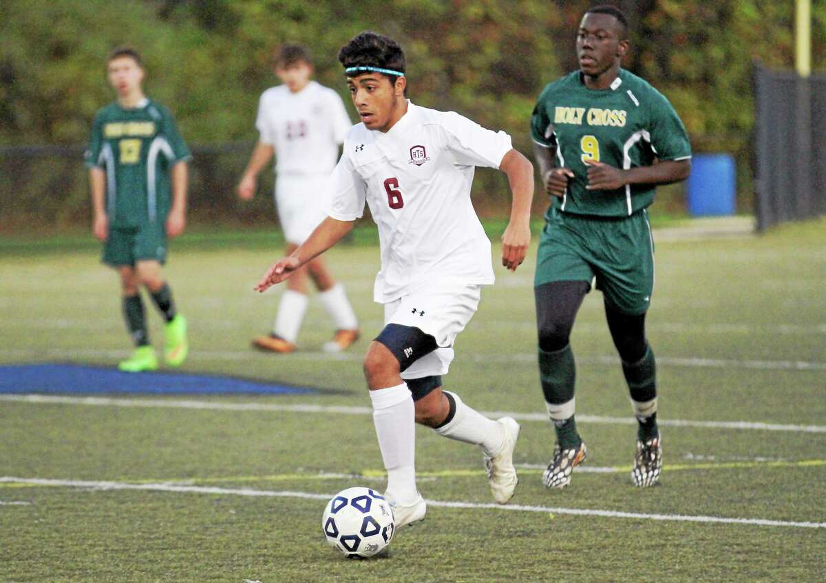 Torrington’s Mike DeSousa dribbles the ball in his team’s win over Holy Cross Saturday night at Municipal Stadium.