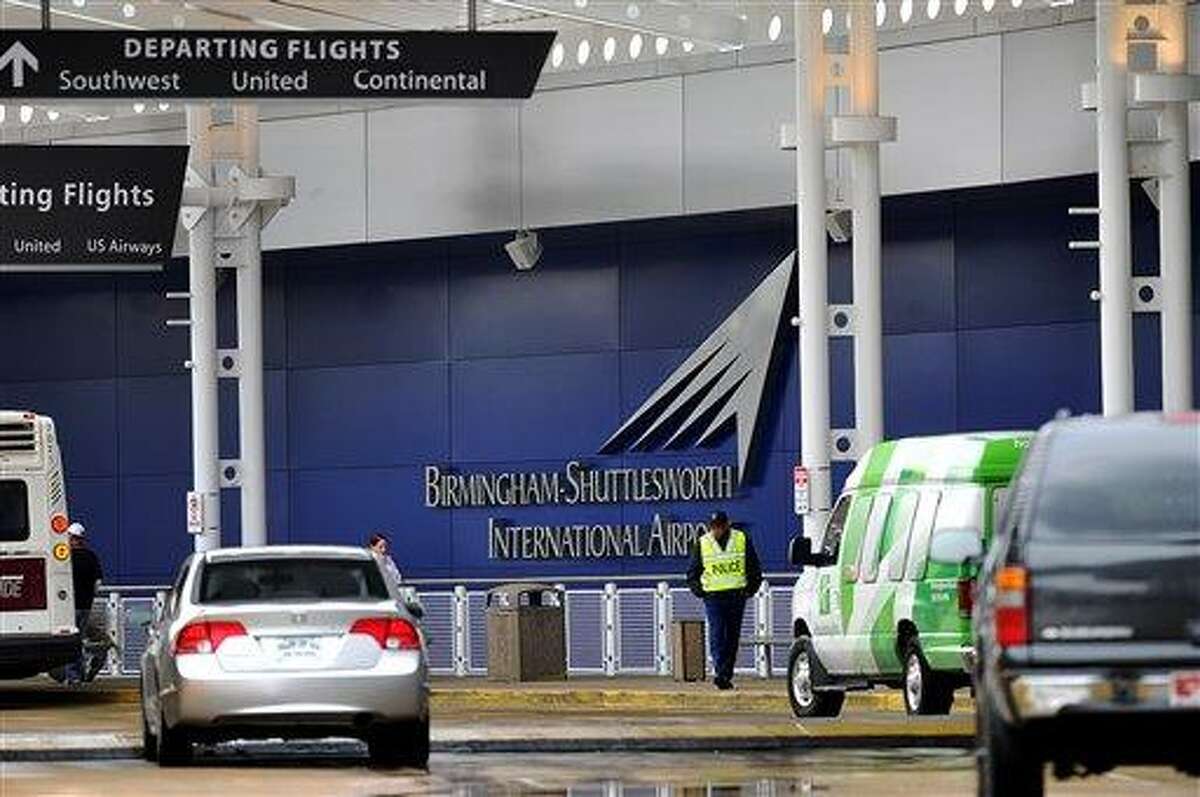 A flight information sign at the newly renovated Birmingham-Shuttlesworth International Airport in Birmingham, Ala., fell on a mother and her three children Friday afternoon, March 22, 2013, killing one child and injuring the mother and her two other children. (AP Photo/Tamika Moore, AL.com)