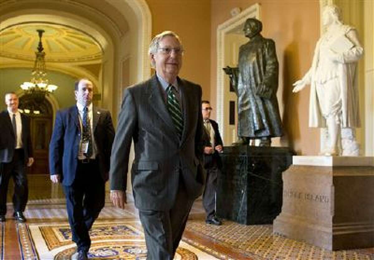 Senate Minority Leader Sen. Mitch McConnell, R-Ken., walks to his office after arriving on Capitol Hill on Monday.