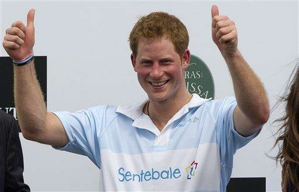 FILE - In this Sunday March 11, 2012 file photo Britain's Prince Harry gives a thumbs up during the award ceremony after playing a charity polo match in Campinas, Brazil. St. James's Palace say Monday March 25, 2013, Prince Harry is returning to the United States -- but this time he's skipping Las Vegas. (AP Photo/Andre Penner, File)