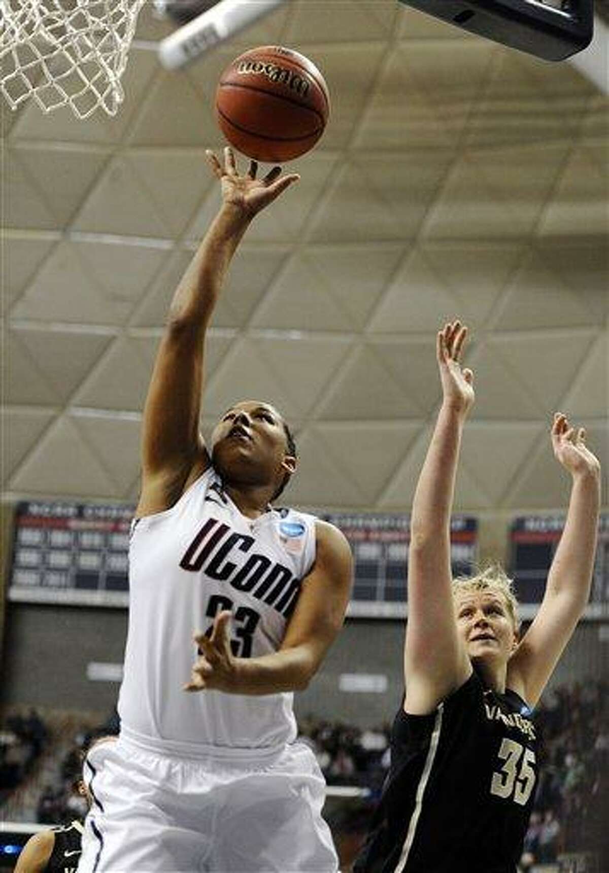 Connecticut's Kaleena Mosqueda-Lewis goes up for a basket while guarded by Vanderbilt's Kendall Shaw in the first half of a second-round game in the women's NCAA college basketball tournament in Storrs, Conn., Monday, March 25, 2013. Connecticut won 77-44. (AP Photo/Jessica Hill)