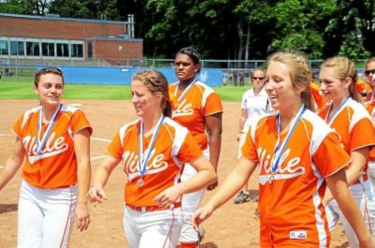 Photo by Sean Meenaghan The Terryville Kangaroos wearing their second place medals walk to the plate to pick up their Class S state championship second place plaque.