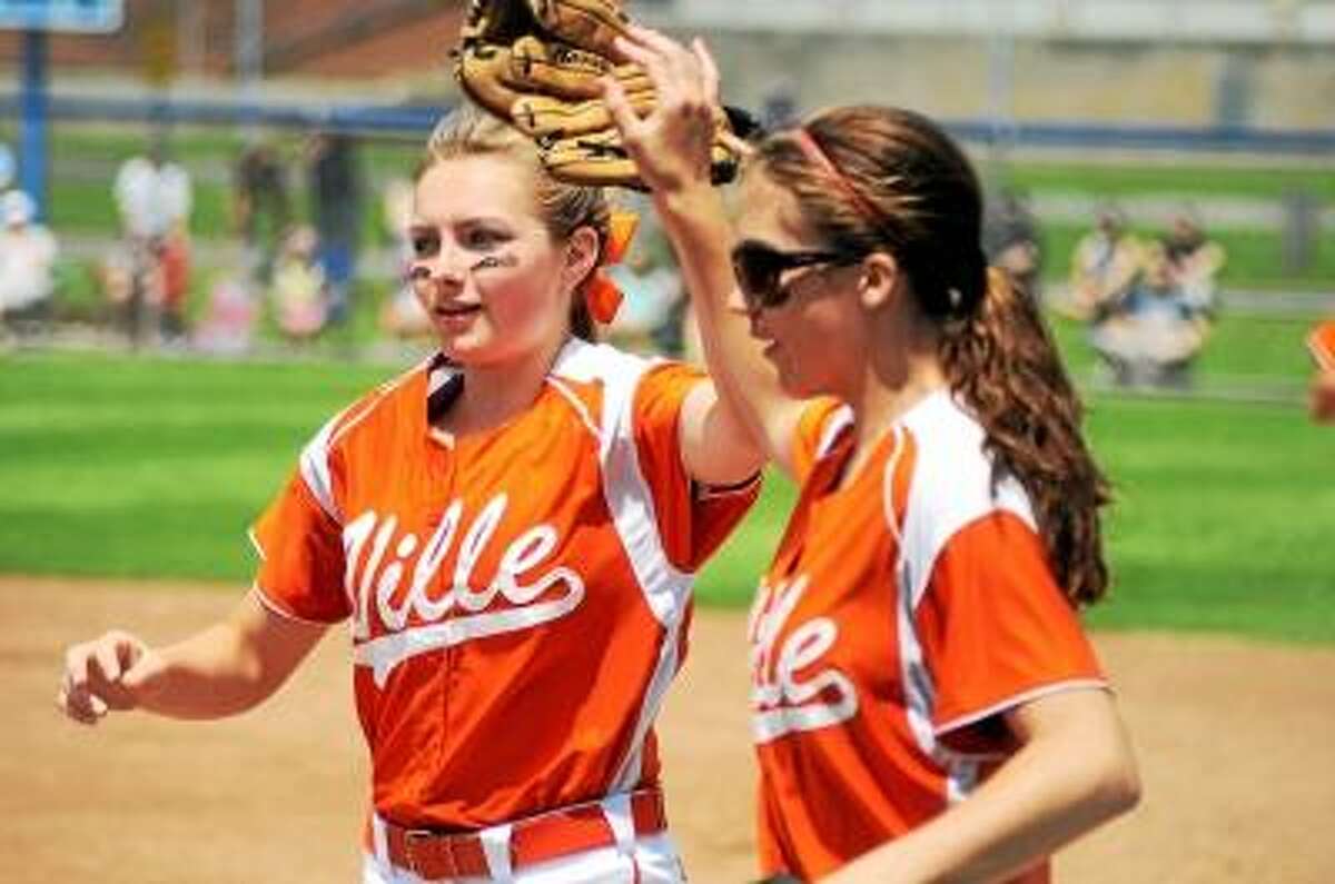Photo by Sean Meenaghan Terryville second baseman Angel Katiewicz (left) celebrates with Terryville first baseman Kristina Hull after getting an out. Oxford defeated Terryville 1-0.