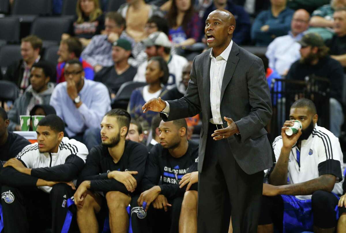 Orlando Magic coach Jacque Vaughn watches the action against the Philadelphia 76ers during a preseason game on Saturday in Allentown, Pa.