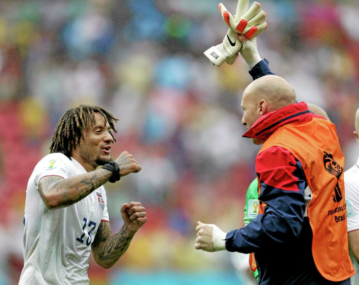 United States midfielder Jermaine Jones, left, celebrates with a teammate after qualifying for the next World Cup round despite a 1-0 loss to Germany Thursday at the Arena Pernambuco in Recife, Brazil.