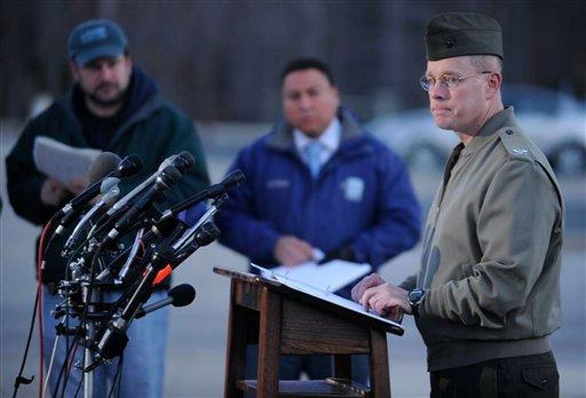 Col. David W. Maxwell holds a press conference at the Marine Corps Museum in Quantico, Va., on Friday, March 22, 2013 regarding a murder/suicide that occurred on Thursday night that resulted in the deaths of three Marines. A Marine killed a male and female colleague in a shooting at a base in northern Virginia before killing himself, officials said early Friday. (AP Photo/The Free Lance-Star, Peter Cihelka)