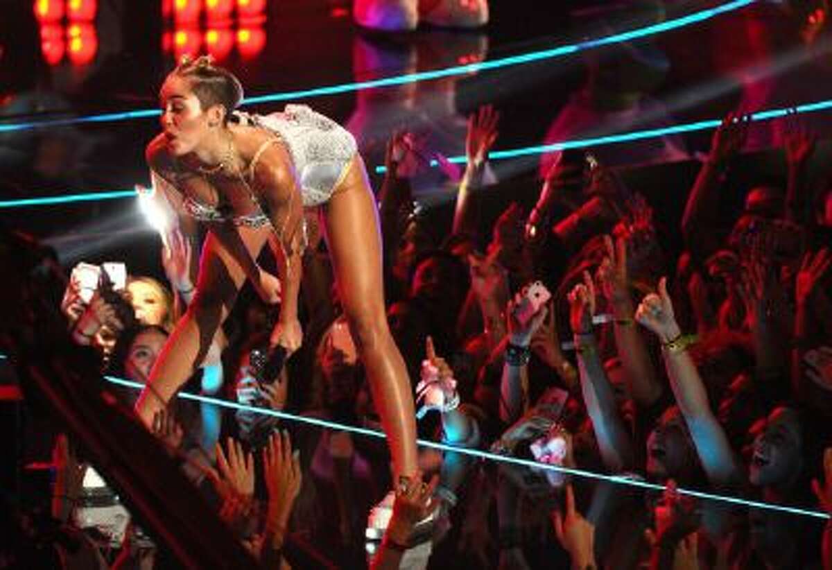 In this Aug. 25, 2013 file photo, Miley Cyrus performs at the MTV Video Music Awards at the Barclays Center in New York.