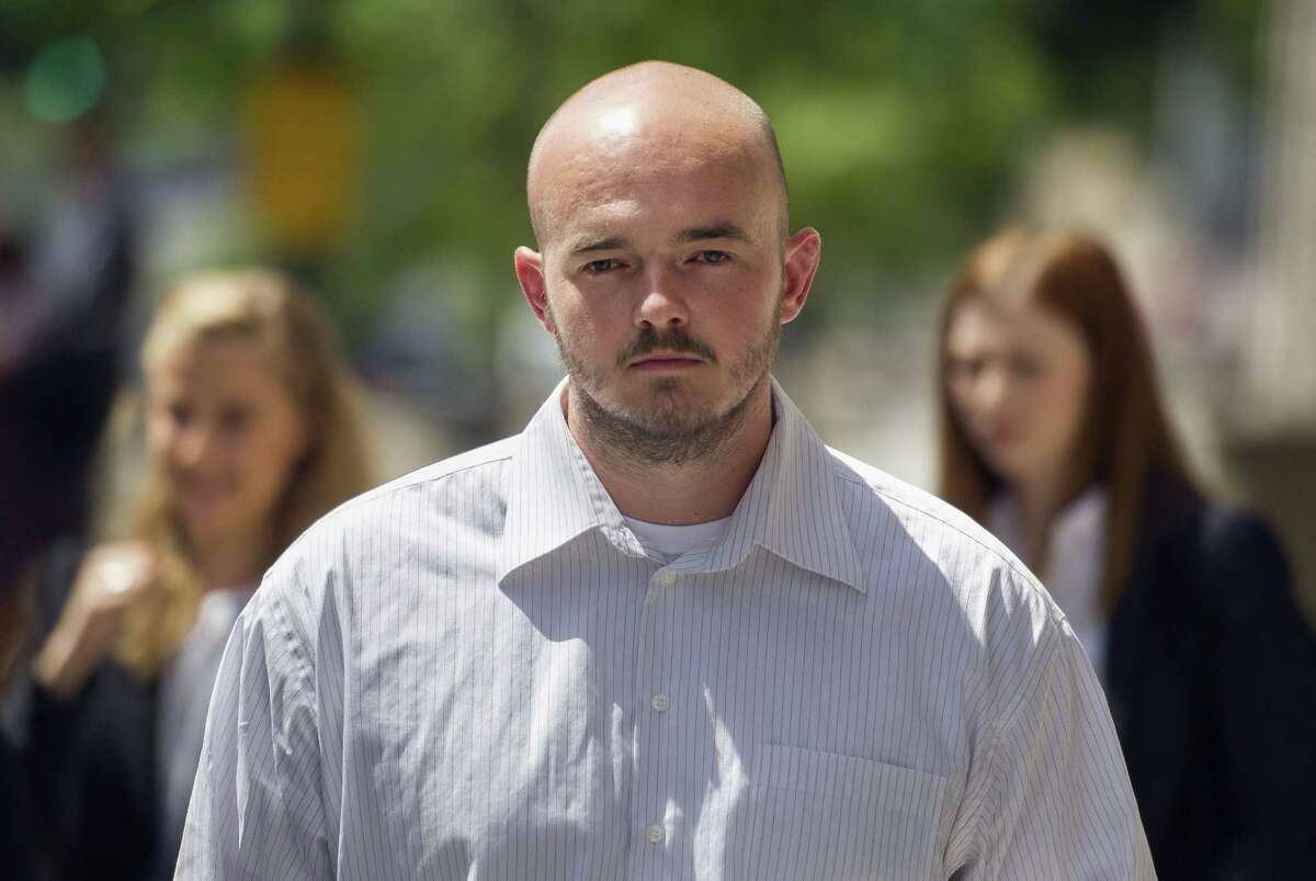 FILE - In this June 11, 2014, file photo, former Blackwater Worldwide guard Nicholas Slatten leaves federal court in Washington. A jury returned guilty verdicts for Slatten and three other former Blackwater guards charged in Iraq shootings. (AP Photo/Cliff Owen, File)