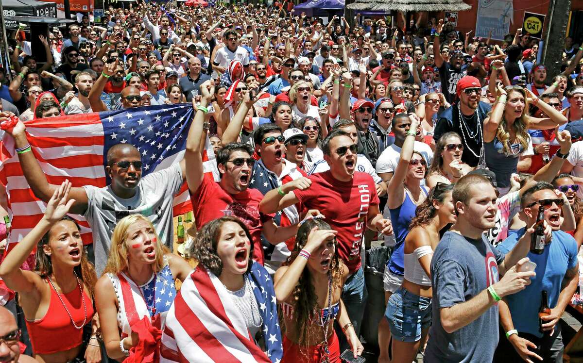 Fans react to a missed shot on goal by the United States as they watch a World Cup soccer match between the United States and Germany, Thursday, June 26, 2014, in Orlando, Fla. (AP Photo/John Raoux)