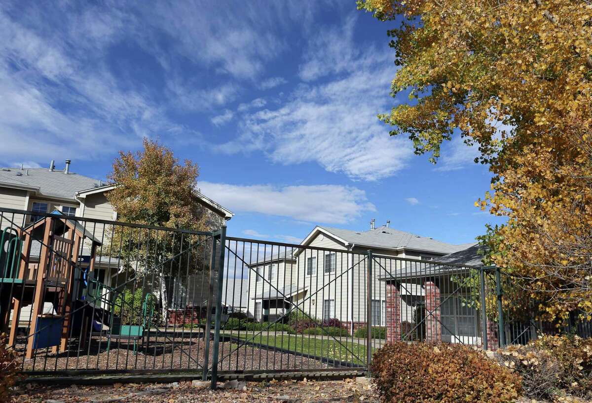 This Wednesday, Oct. 22, 2014, photo shows the apartment complex in Aurora, Colo., which police say is the home of one of the three teenage girls who, according to U.S. authorities, were en route to join the Islamic State group in Syria when they were stopped at an airport in Germany. The two sisters, ages 17 and 15, and their 16-year-old friend have been reunited with their families in Colorado, according to an FBI spokeswoman.