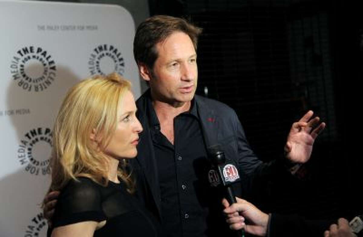 Actors Gillian Anderson and David Duchovny attend "The Truth Is Here: David Duchovny and Gillian Anderson on The X-Files" at The Paley Center for Media on Saturday, Oct. 12, 2013 in New York.