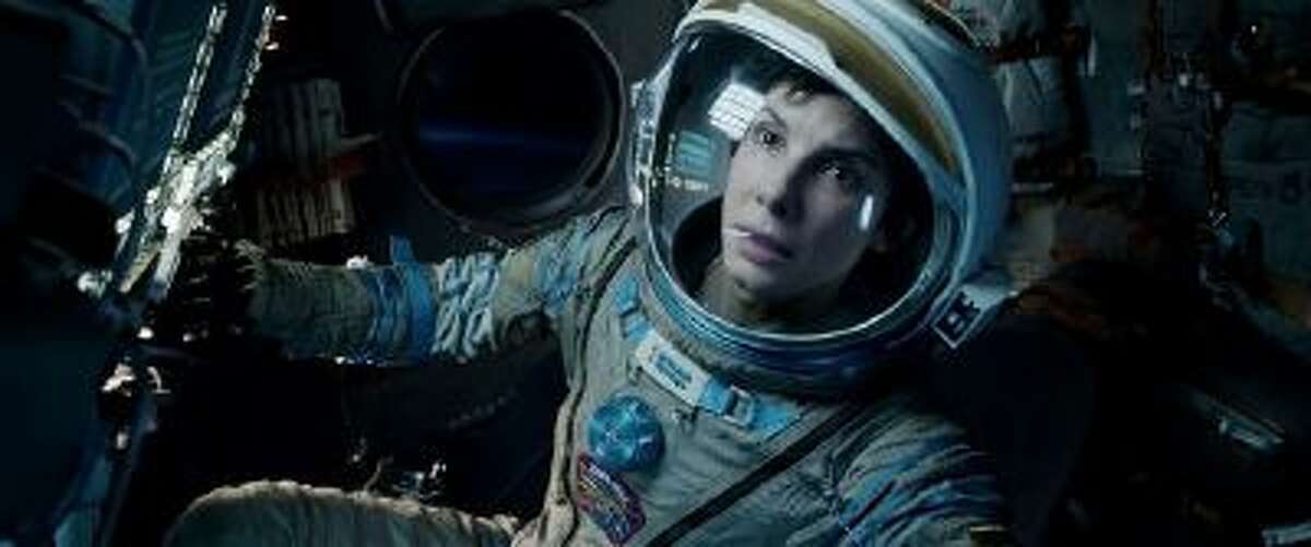 This film image released by Warner Bros. Pictures shows Sandra Bullock in a scene from "Gravity." Bullock says making the lost-in-space movie directed by Alfonso Cuaron was her "best life decision" ever. (AP Photo/Warner Bros. Pictures)
