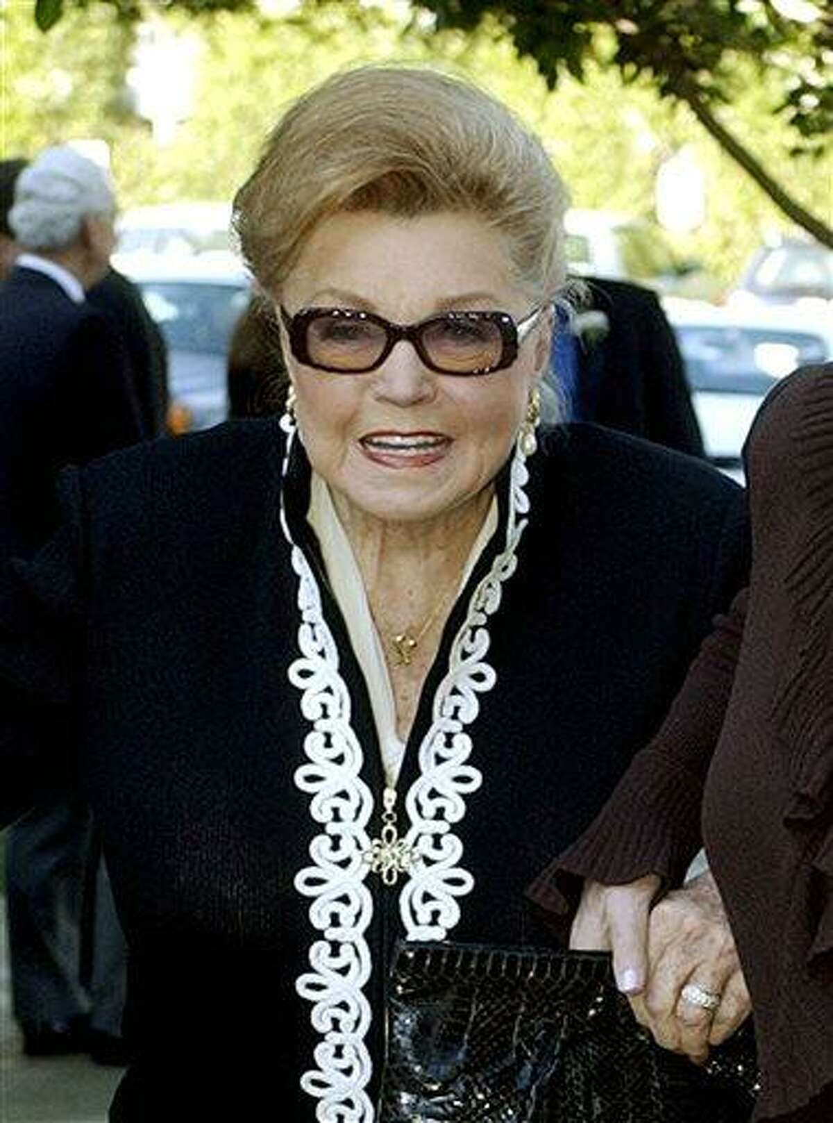 FILE - This Jan. 28, 2004 file photo shows Esther Williams at the funeral service for dancer/actress Ann Miller at St. Mel Catholic Church in Los Angeles' Woodland Hills area. According to a press representative, Williams died in her sleep on Thursday, June 6, 2013, in Beverly Hills, Calif. She was 91. (AP Photo/Reed Saxon, file)