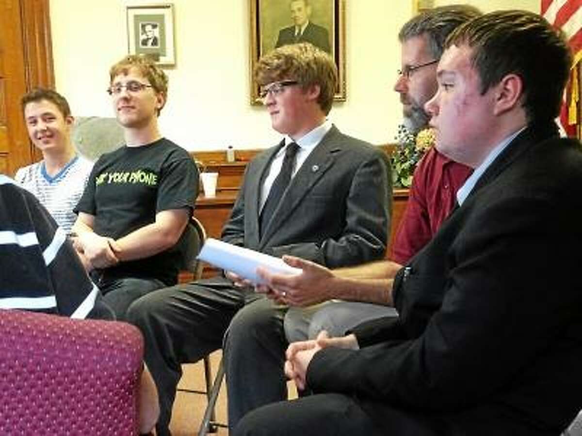 Torrington High School students advocate to the Torrington Board of Education's policy committee, to loosen restrictions on electronic device use in the district. (Jessica Glenza/Register Citizen)
