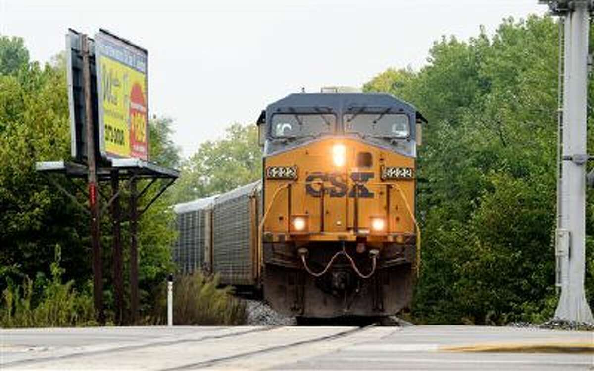 A train speeds through Columbus, Ind. in this Oct. 1 file photo.