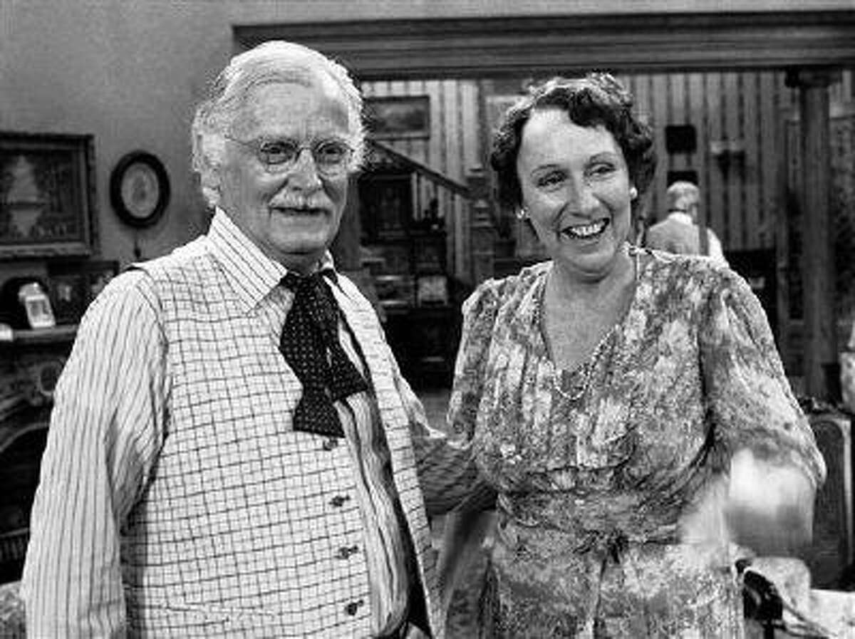 FILE - Co-stars Art Carney, left, and Jean Stapleton stand together during a rehearsal for the play "You Can't Take it With You" in Los Angeles on May 14, 1979. Stapleton has died at the age of 90. John Putch said Saturday, June 1, 2013 that his mother died Friday, May 31, 2013 of natural causes at her New York City home surrounded by friends and family. (AP Photo/Brich)