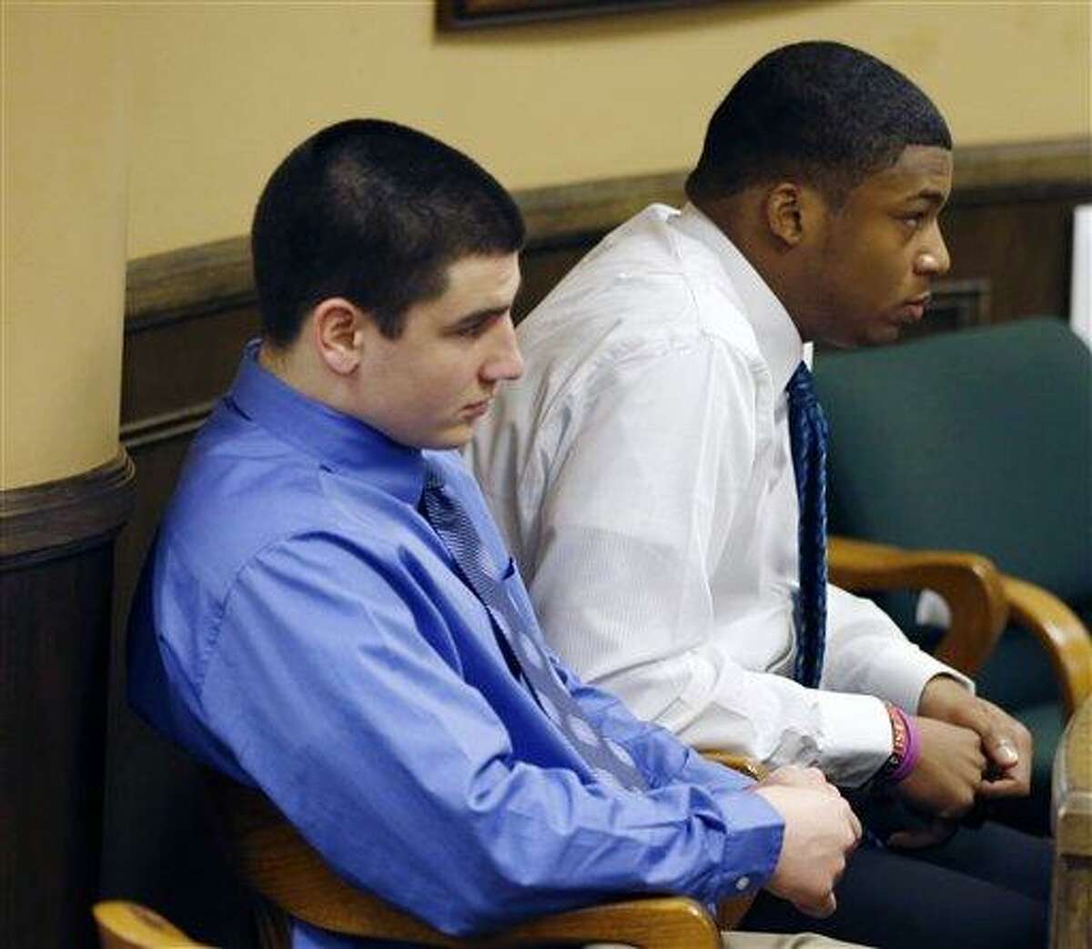 Trent Mays, 17, left, and co-defendant 16-year-old Ma'lik Richmond sit in court before the start of the third day of their trial on rape charges in juvenile court on Friday, March 15, 2013 in Steubenville, Ohio. Mays and Richmond are accused of raping a 16-year-old West Virginia girl in August of 2012. (AP Photo/Keith Srakocic, Pool)