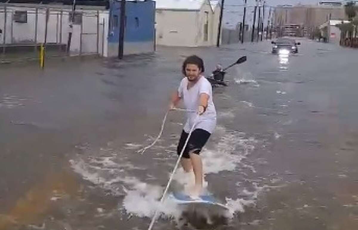 Harvey: Viral video shows man street surfing in Galveston