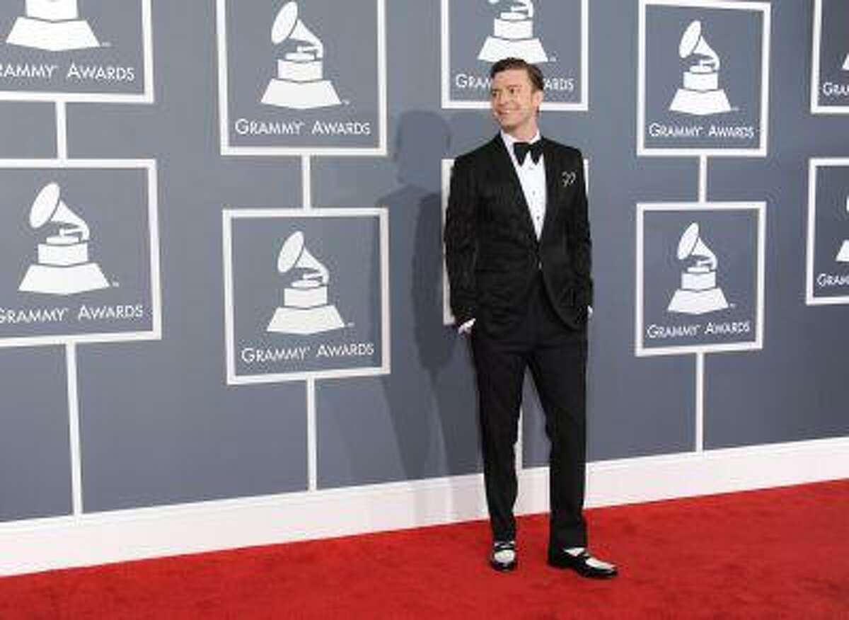 FILE - In this Feb. 10, 2013 file photo, musician Justin Timberlake arrives at the 55th annual Grammy Awards, in Los Angeles. "Mad Men" star Jon Hamm is going mad over Justin Timberlake's suit and tie, the song and the singer's style. As for Timberlake, Hamm believes the pop star has "always been a very fashion forward kind of guy." (Photo by Jordan Strauss/Invision/AP, File)
